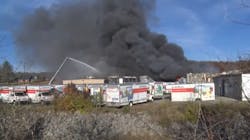 Firefighters use an aerial ladder to control a commercial fire in Beckley, WV, on Wednesday, Nov. 17, 2021. Firefighters use an aerial ladder to control a commercial fire in Beckley, WV, on Wednesday, Nov. 17, 2021.