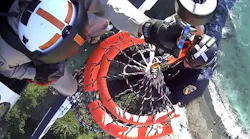 Rescuers use a Billy Pugh basket to extract the stranded hiker.