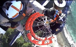 Rescuers use a Billy Pugh basket to extract the stranded hiker. Rescuers use a Billy Pugh basket to extract the stranded hiker.