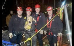 Wintergreen fire and rescue Technical Rescue Team member pose with Dusty after her rescue. Wintergreen fire and rescue Technical Rescue Team member pose with Dusty after her rescue.