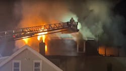 A ladder tower operates during at a fatal fire with multiple rescues and injuries A ladder tower operates during at a fatal fire with multiple rescues and injuries