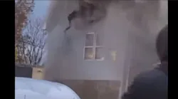 Heavy smoke and fire force a woman to jump from a second story window on Nov. 26, 2021