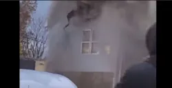 Heavy smoke and fire force a woman to jump from a second story window on Nov. 26, 2021