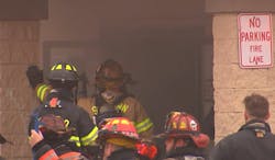 Firefighters battle fire as it runs between floors of a commercial building on Nov. 28, 2021 Firefighters battle fire as it runs between floors of a commercial building on Nov. 28, 2021