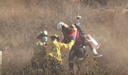 San Diego fire crews air lifting a hiker from Cowles Mountain via helicopter.