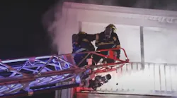 Firefighters work to extinguish a fire intentionally set on Nov. 29, 2021.