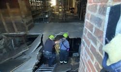 Boston firefighters use a ground ladder to gain access to a trapped individual Boston firefighters use a ground ladder to gain access to a trapped individual