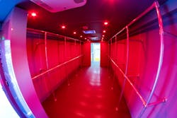 The interior of PCFR’s new decon apparatus will facilitate hanging PPE on two levels on each side: coats on one side, trousers on the other. Two roof-mounted air-conditioning units and two roof-mounted vents. Toward the rear is a small room just past the passageway. Cabinets in that room can be used to store supplies and equipment to handle minor repairs on scene, such as helmet repairs. The interior of PCFR’s new decon apparatus will facilitate hanging PPE on two levels on each side: coats on one side, trousers on the other. Two roof-mounted air-conditioning units and two roof-mounted vents. Toward the rear is a small room just past the passageway. Cabinets in that room can be used to store supplies and equipment to handle minor repairs on scene, such as helmet repairs.