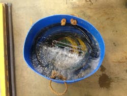 Frozen precipitation made its way into a special operations trailer through a leak in the roof. The trailer was parked outside. The pneumatic hoses that were coiled in this makeshift container were destroyed. Frozen precipitation made its way into a special operations trailer through a leak in the roof. The trailer was parked outside. The pneumatic hoses that were coiled in this makeshift container were destroyed.