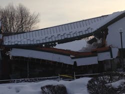 This strip mall suffered a catastrophic collapse when the roof scupper holes were frozen and accumulated snow wasn&rsquo;t able to drain from the structure.