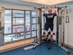 A firefighter works out in the fitness room at Fire Hall No. 5 in Vancouver, British Columbia.