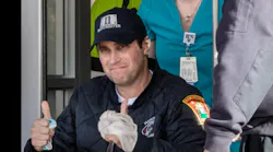 Manchester Fire Captain Steve DesRuisseaux gives thumbs up to his supporters.