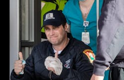 Manchester Fire Captain Steve DesRuisseaux gives thumbs up to his supporters. Manchester Fire Captain Steve DesRuisseaux gives thumbs up to his supporters.