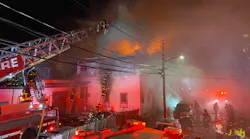Boston firefighters tackle an eight-alarm fire that burned for several hours in a music school Friday.