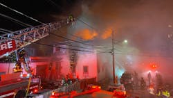 Boston firefighters tackle an eight-alarm fire that burned for several hours in a music school Friday.