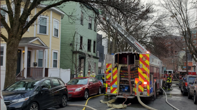 A three-alarm fire in Cambridge Wednesday morning claimed the life of an 80-year-old woman.