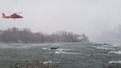 A U.S. Coast Guard helicopter rescue crew recovered the body of a woman whose car travelled in the rapid waters of the Niagara River on the brink of Niagara Falls. A U.S. Coast Guard helicopter rescue crew recovered the body of a woman whose car travelled in the rapid waters of the Niagara River on the brink of Niagara Falls.