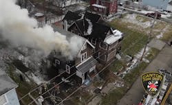 Smoke pushes from the second floor as firefighters work to control fire in a Canton home. Smoke pushes from the second floor as firefighters work to control fire in a Canton home.