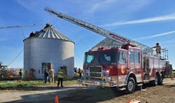 Multiple public safety agencies work to free a farmer trapped in a Mt. Auburn grain bin. Multiple public safety agencies work to free a farmer trapped in a Mt. Auburn grain bin.