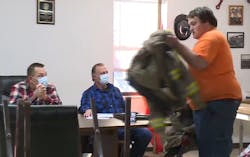 A firefighter resigns on the spot during a board meeting that promoted a once convicted arsonist to Acting Chief.