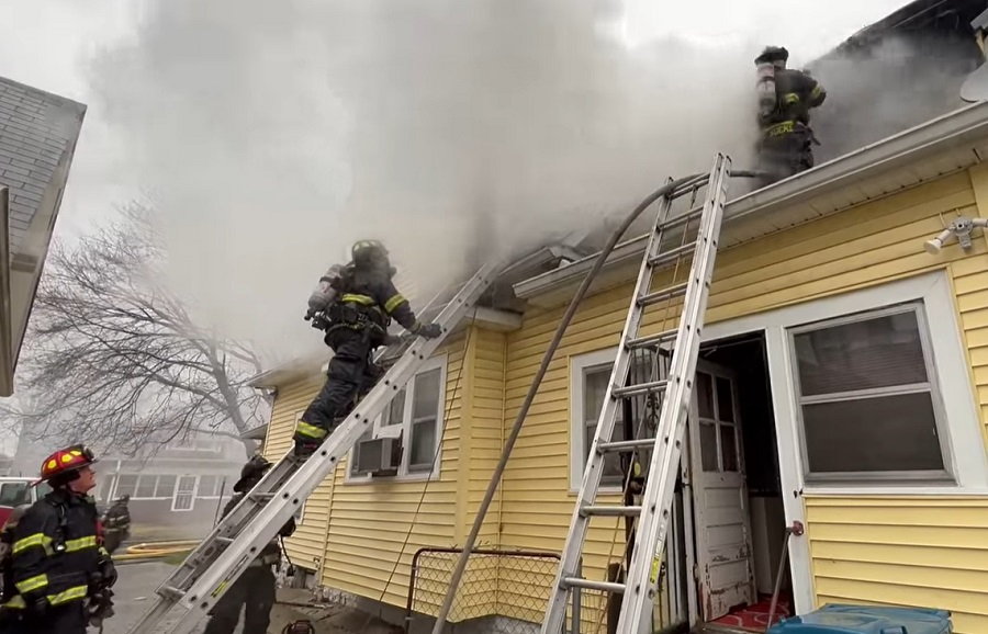 Indianapolis firefighters work to bring a dwelling fire under control on Tuesday, Dec. 28, 2021.