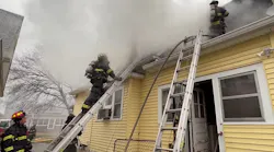 Indianapolis firefighters work to bring a dwelling fire under control on Tuesday, Dec. 28, 2021.