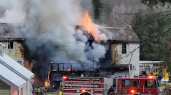 Firefighter work to control a residential fire in Hudson on Dec. 9, 2021.