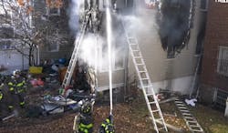 Firefighters work to extinguish a Bronx dwelling fire.