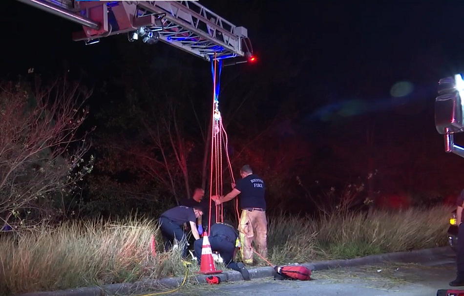 Houston firefighters worked to rescue a woman after she fell 20 feet into a manhole.