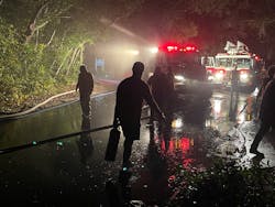 Neighbors pitched in to help firefighters on the remote island where lighting was limited, slowing access. Neighbors pitched in to help firefighters on the remote island where lighting was limited, slowing access.