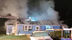 Firefighters work to control a Cumberland house fire owned by a Barlow firefighter.