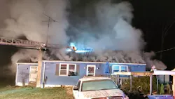 Firefighters work to control a Cumberland house fire owned by a Barlow firefighter.