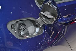 Opening the small cover door of this Volkswagen e-Golf EV reveals a receptacle for a charging cord. Opening the small cover door of this Volkswagen e-Golf EV reveals a receptacle for a charging cord.