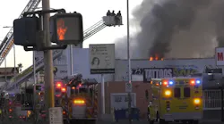 Fire crews work to control a commercial fire in Las Vegas.