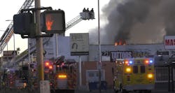 Fire crews work to control a commercial fire in Las Vegas. Fire crews work to control a commercial fire in Las Vegas.