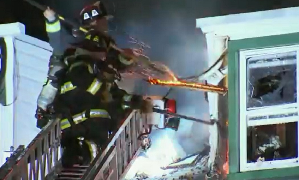 Fire crews work to expose fire at a 4-alarm event in Chelsea.