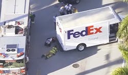 Firefighters assess injuries and extrication needs of a FedEx driver who was run over by his own vehicle. Firefighters assess injuries and extrication needs of a FedEx driver who was run over by his own vehicle.