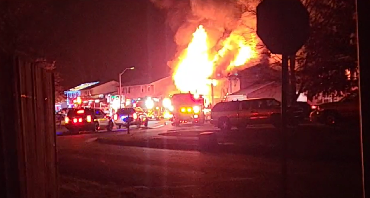 Heavy fire engulfed the Quakertown home Christmas morning preventing firefighters from getting inside to rescue three people.