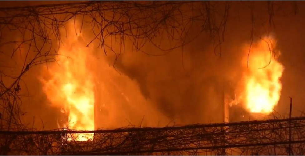 Heavy fire pushes out the second floor windows at a Rochester fire.