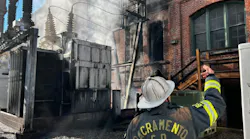 Officers survey the scene after fire damaged a substation and building in Sacramento.