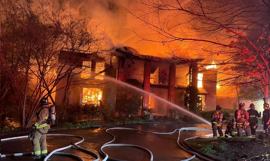 Firefighters from multiple agencies work to control fire in the home of former VA Gov. Chuck Robb