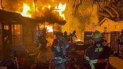 Fire engulfs a two-story home early Thursday that left two people dead and another injured.