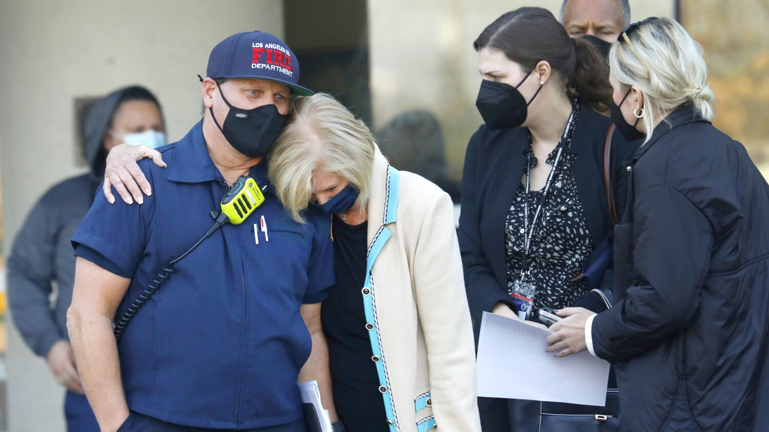 Los Angeles County Supervisor Janice Hahn hugs Capt. Dave Gillotte at a press conference at Harbor-UCLA Medical Center in Torrance, CA after a firefighter was killed while fighting a fire in Rancho Palos Verdes on Jan. 6.
