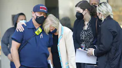 Los Angeles County Supervisor Janice Hahn hugs Capt. Dave Gillotte at a press conference at Harbor-UCLA Medical Center in Torrance, CA after a firefighter was killed while fighting a fire in Rancho Palos Verdes on Jan. 6.