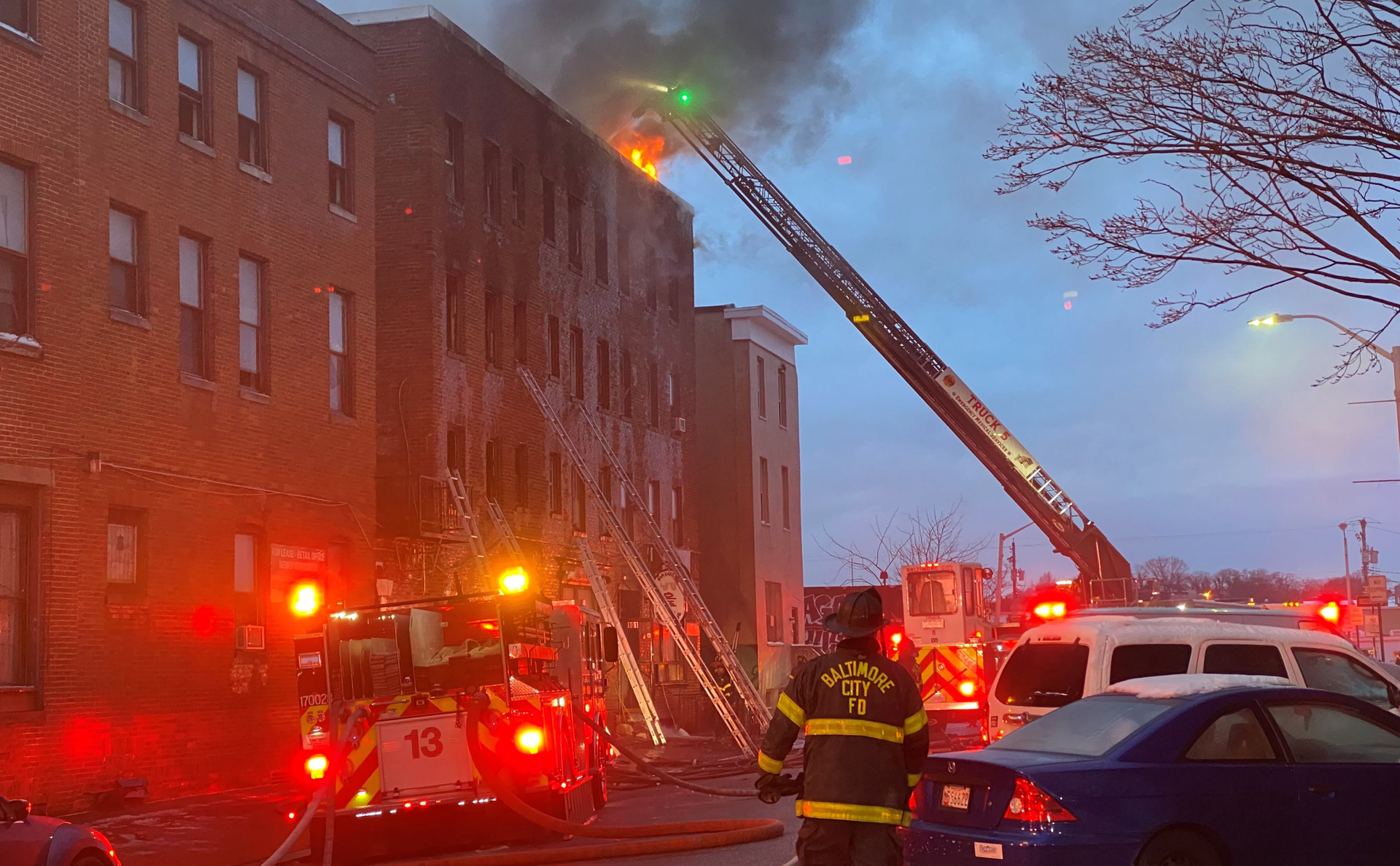 Baltimore firefighters made multiple rescues at a 4-alarm apartment fire Wednesday morning.