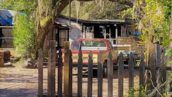 The gutted remains of the former two-story home are visible hours after Thursday's 3:30 a.m. fire was reported and extinguished.