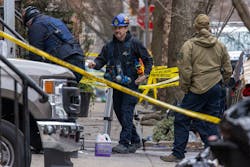 Philadelphia Fire Department fire marshals along with ATF officials investigate the remains of a rowhouse fire where 12 people died Wednesday. Philadelphia Fire Department fire marshals along with ATF officials investigate the remains of a rowhouse fire where 12 people died Wednesday.