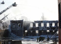 Firefighters from throughout New Jersey continue to fight the Passaic fire Saturday morning.