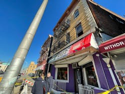 Investigators work at the scene where a Passaic firefighter rescued a woman from an apartment building at 896 Main Avenue on Wednesday. Investigators work at the scene where a Passaic firefighter rescued a woman from an apartment building at 896 Main Avenue on Wednesday.