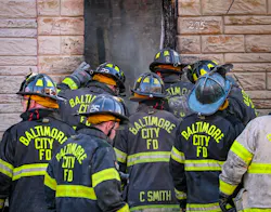 Baltimore City firefighters at the South Stricker Street rowhome fire scene Monday. Baltimore City firefighters at the South Stricker Street rowhome fire scene Monday.